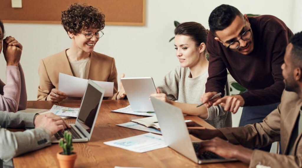 Diverse team collaborating on digital marketing strategies for business growth.